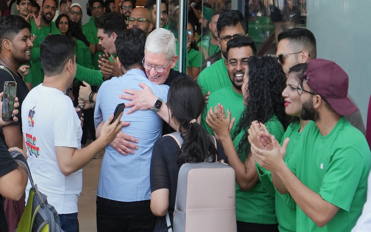 Apple's first store opens in Delhi, CEO Cook welcomes customers.